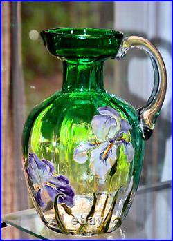 F. T. LEGRAS. Verseuse en verre teinté, à décor émaillé d'iris. Vers 1900