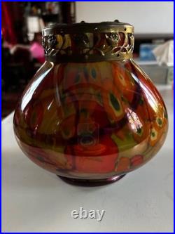 Vase en verre orangé avec pique fleurs en très bon état