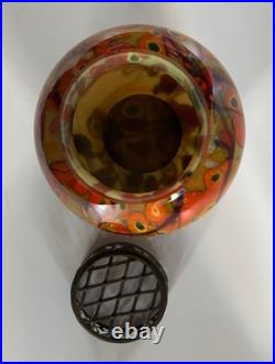 Vase en verre orangé avec pique fleurs en très bon état